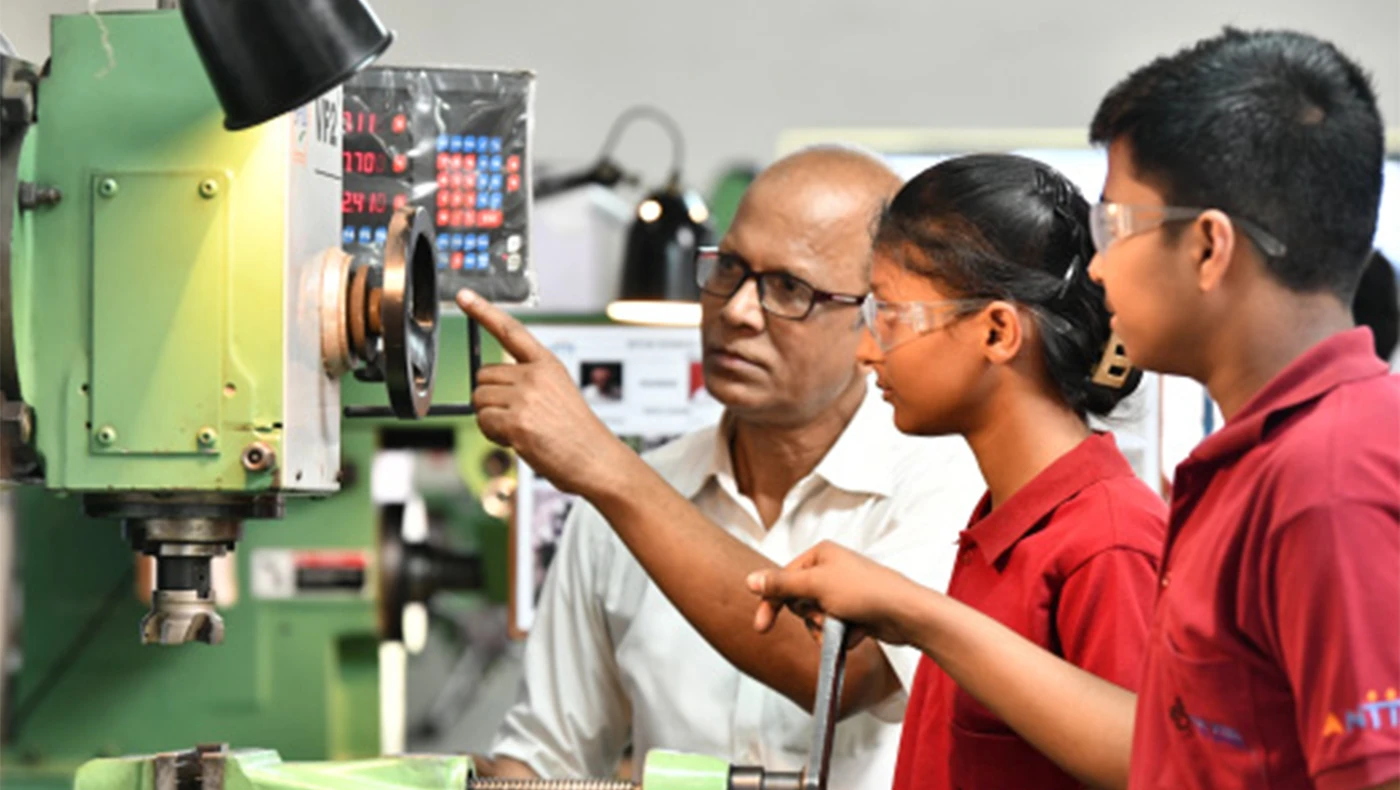 Instructor and students at technical-training equipment at Tata Steel Technical Institute, Jamshedpur; file photograph, not the Odisha PM-SETU upgrade.
